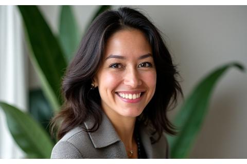 A headshot of Dr. Elena Ramirez, a prominent Austin-based industrial designer, smiling warmly in front of a sleek, minimalist office background with a subtle plant display.